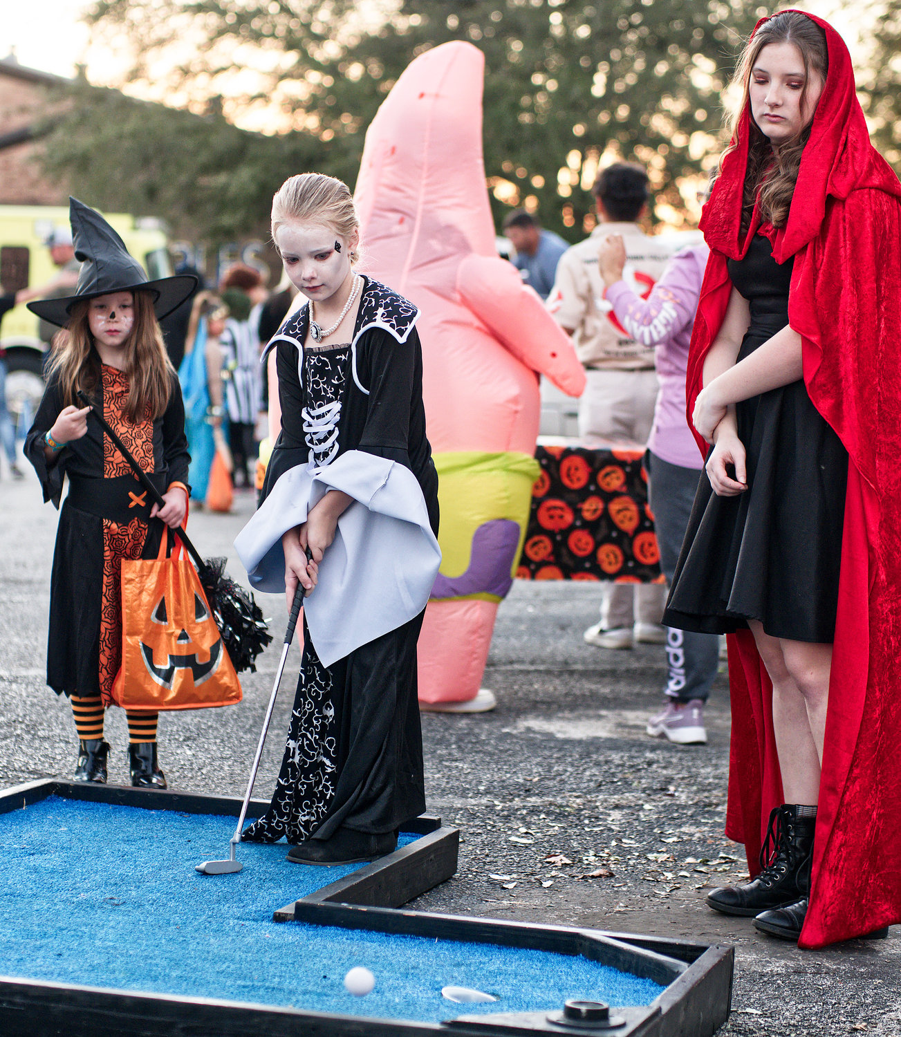 Mini-golfers played the course on the square in Quitman. [See more spooks, if you dare.]